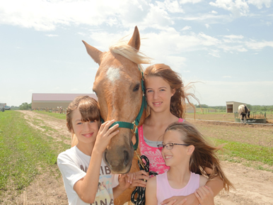 kids with horse at Dakota Stables