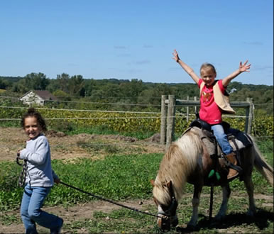 kids riding horses